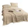 Xuege Home Textiles' off-white vertical striped plush bedding set of four pieces is a warm and comfortable autumn and winter collection Item Picture